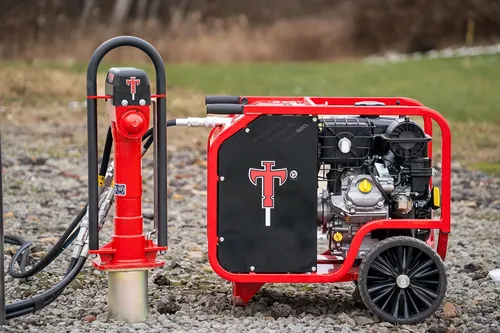 Titan hydraulic post driver and power pack in the field