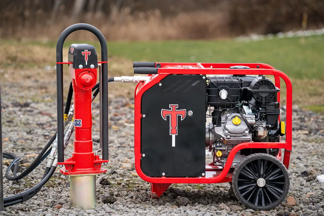 Titan hydraulic post driver and power pack in the field